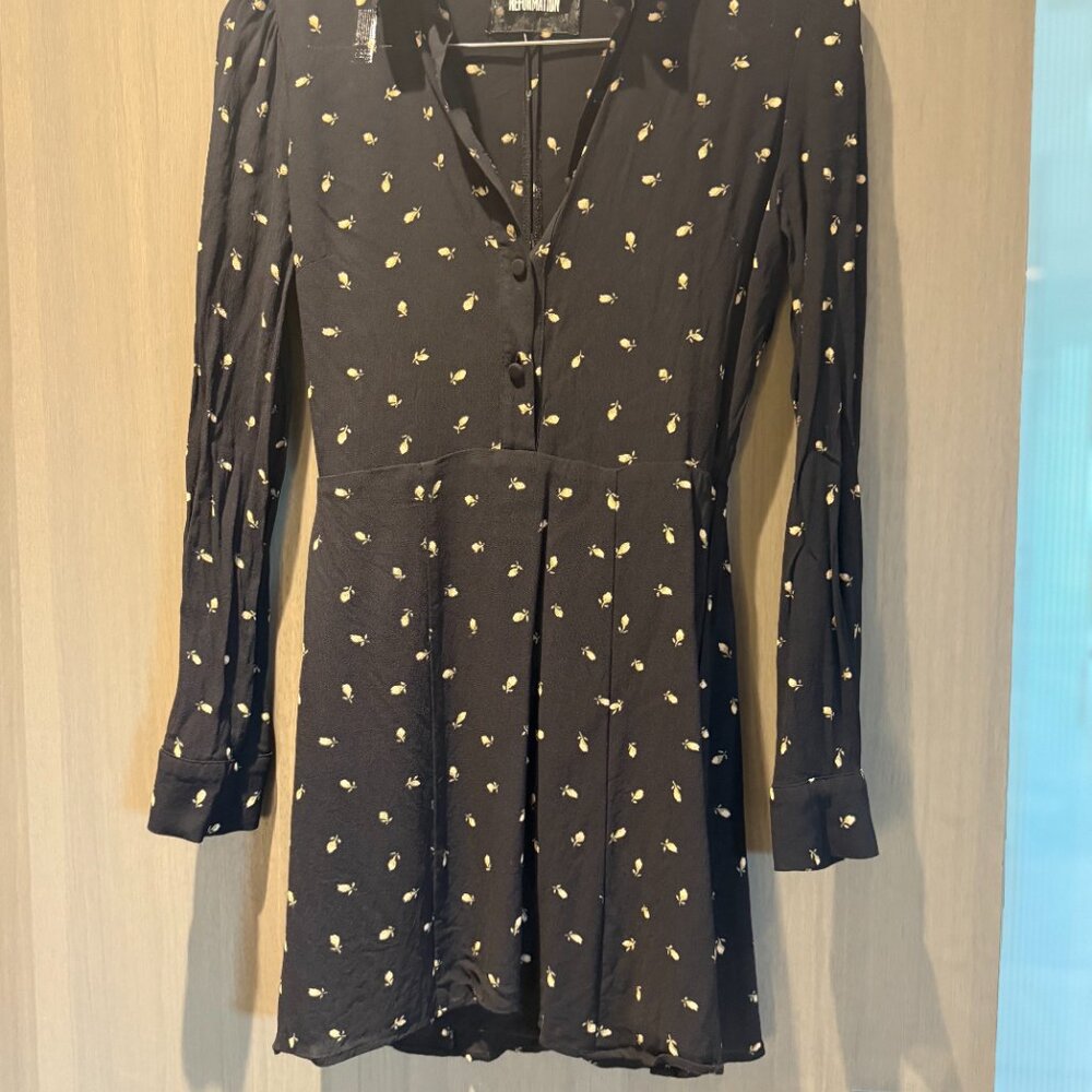 Reformation mini long sleeve fitted black floral dress small slit in back.
